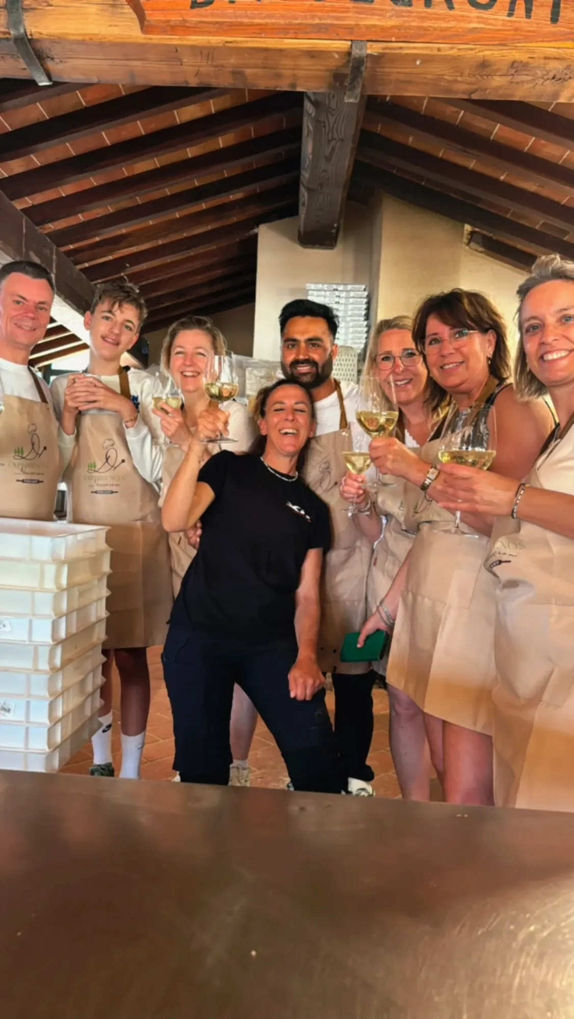 Guests toasting with a glass of wine after the pizza class